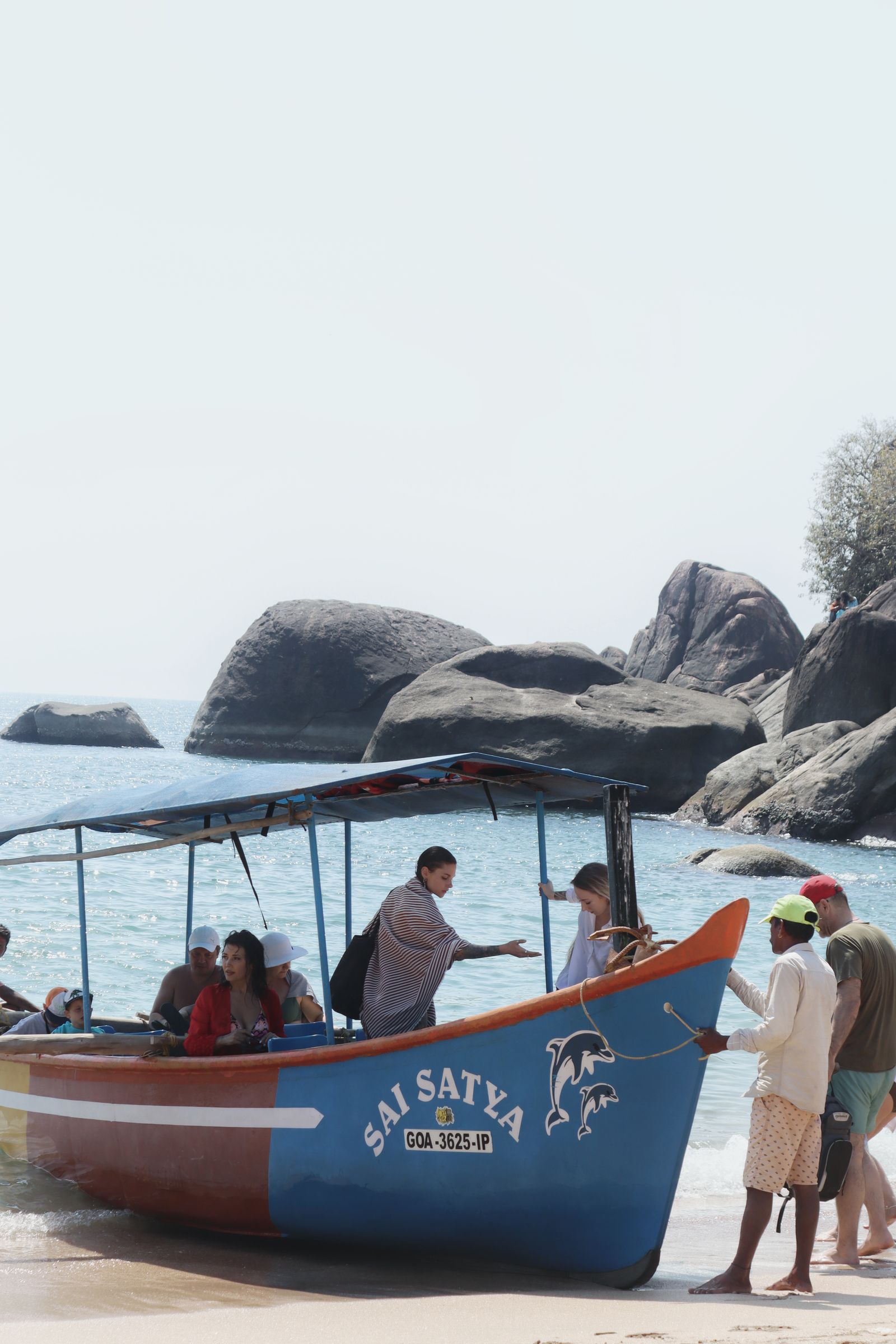 Guests boarding a boat on the coast of Goa